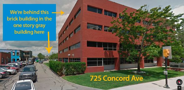 A building with the words " 7 2 5 concord ave." written on it.